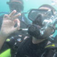 Srin underwater giving the 'ok' signal