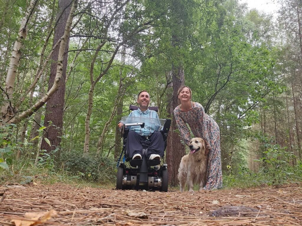 Martyn, Kasia and Sunny the dog in the woods