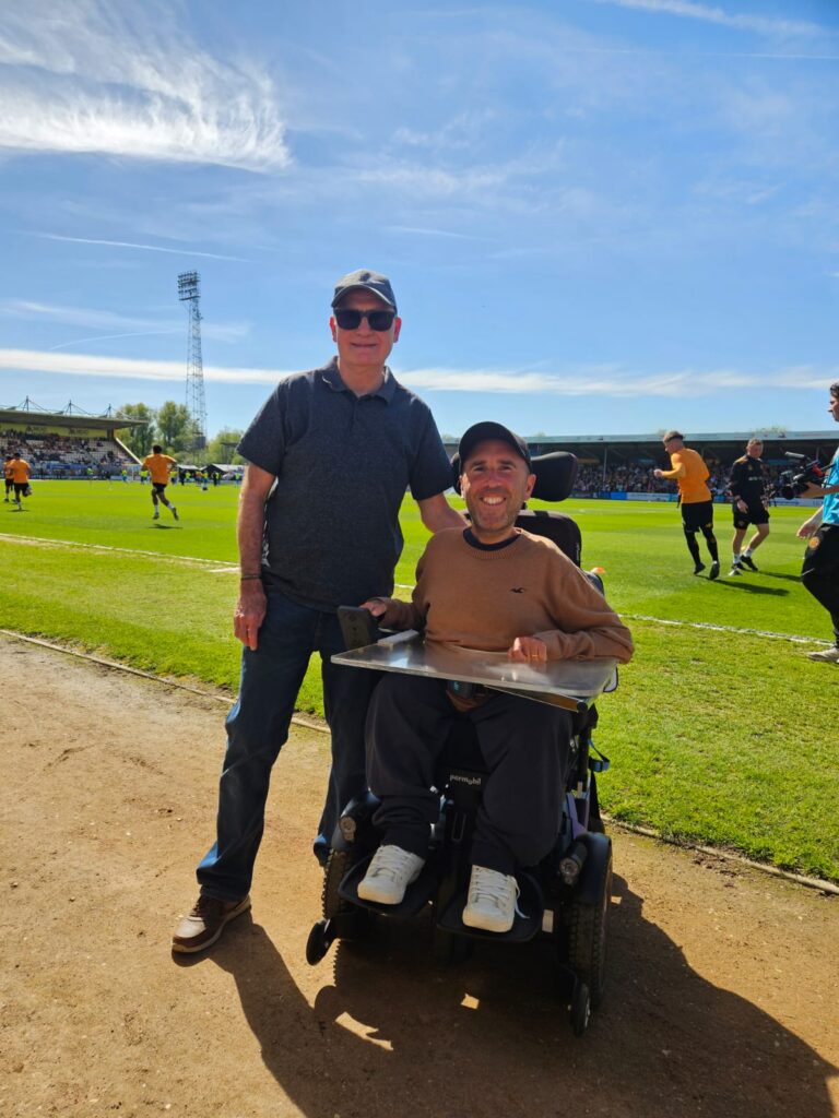 Martyn and his dad at a football match
